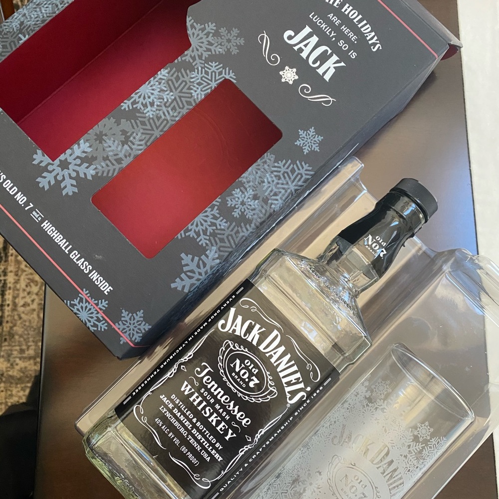 1 Empty Jack Daniels bottle with 1 box and 1 glass.